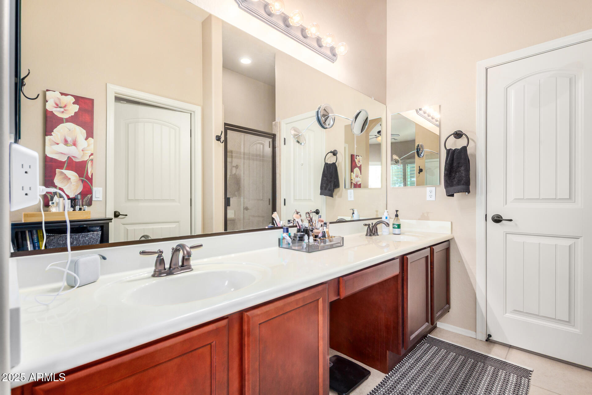 6202 East McKellips Road, Unit 139 Mesa, AZ 85215 - Photo 17 of 54 a bathroom with a double vanity sink mirror and