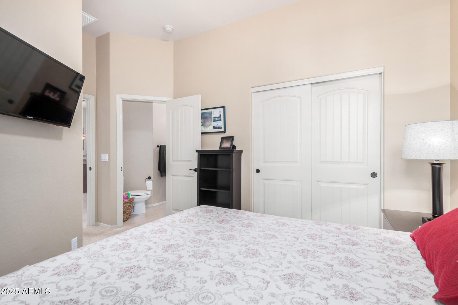 6202 East McKellips Road, Unit 139 Mesa, AZ 85215 - Photo 22 of 54 a bedroom with a bed and a flat screen tv