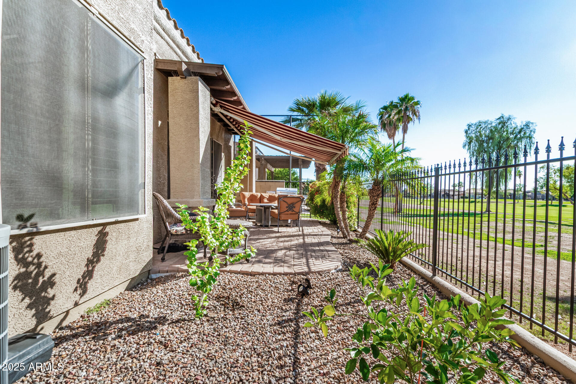 6202 East McKellips Road, Unit 139 Mesa, AZ 85215 - Photo 29 of 54 a view of a chairs and table in the patio