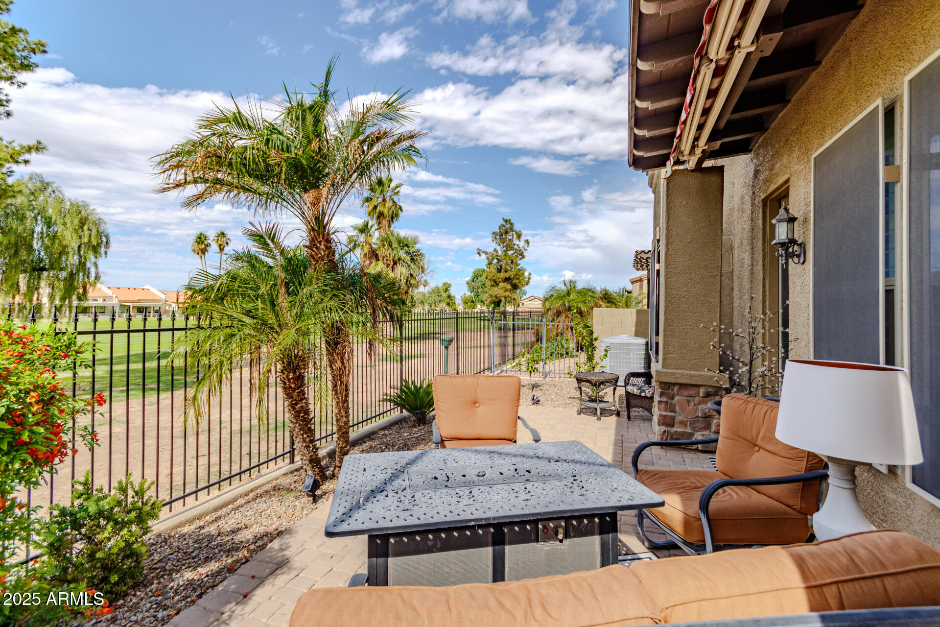 6202 East McKellips Road, Unit 139 Mesa, AZ 85215 - Photo 33 of 54 a view of a patio with couches and table and chairs and potted plants