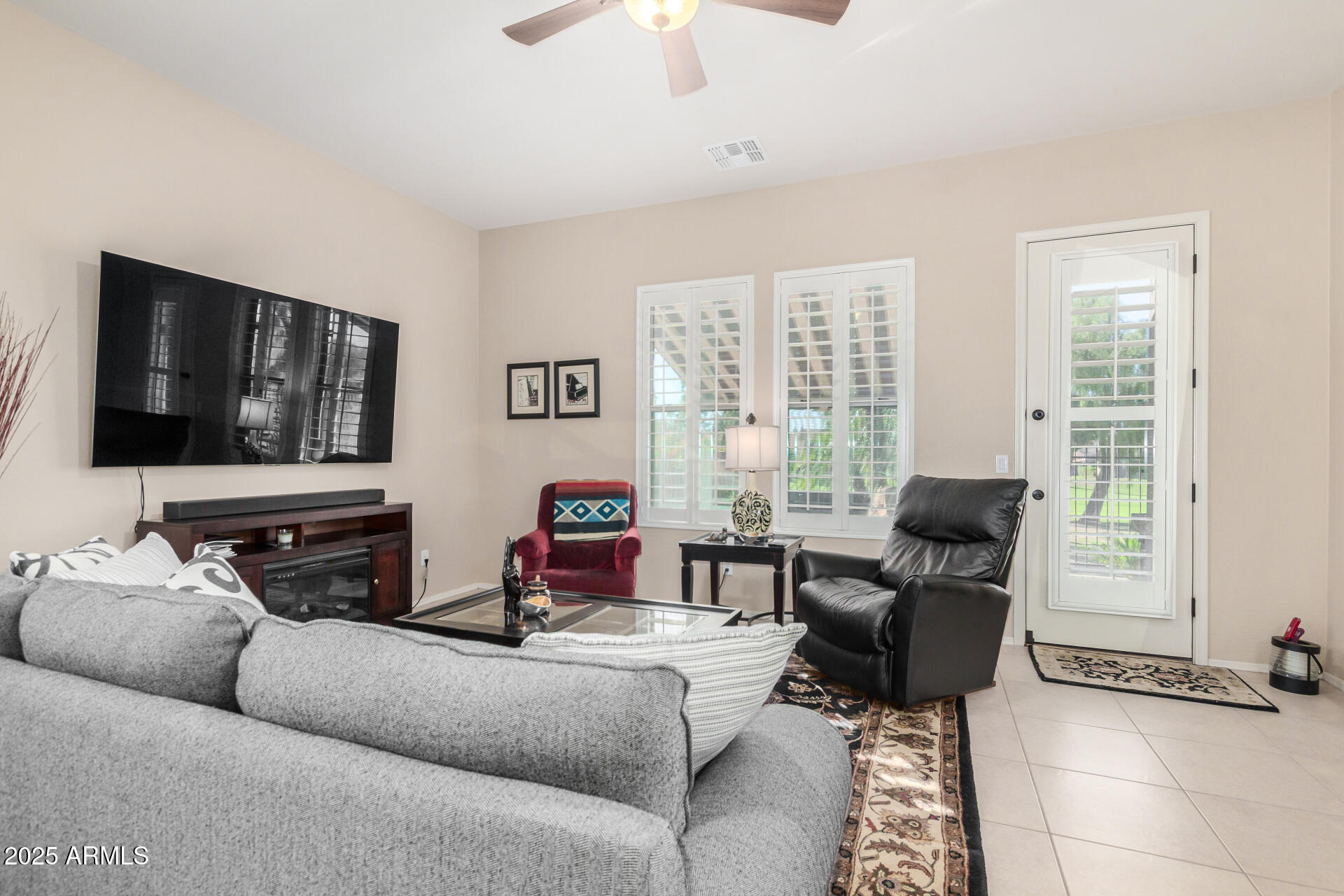6202 East McKellips Road, Unit 139 Mesa, AZ 85215 - Photo 7 of 54 a living room with furniture and a flat screen tv