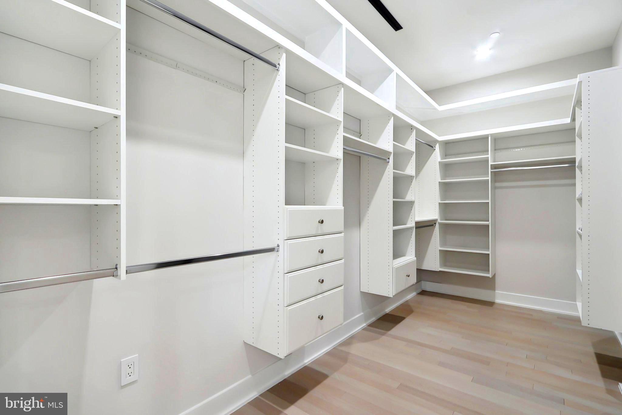 4920 Loughboro Road Northwest Washington, DC 20016 - Photo 22 of 41 a view of walk in closet with empty racks