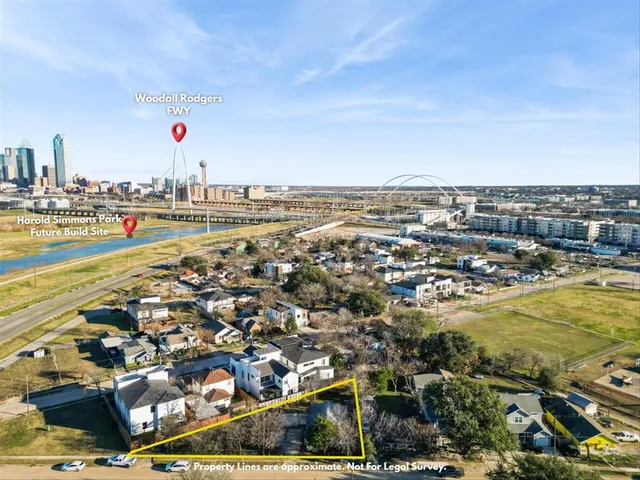 an aerial view of residential building and lake