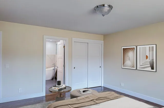 a bathroom with a granite countertop shower sink and toilet