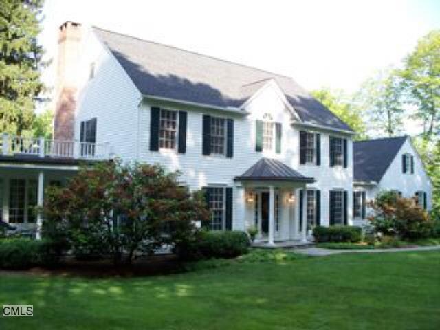 8 Main Street Ridgefield, CT 06877 - Photo 1 of 1 a front view of a house with a garden
