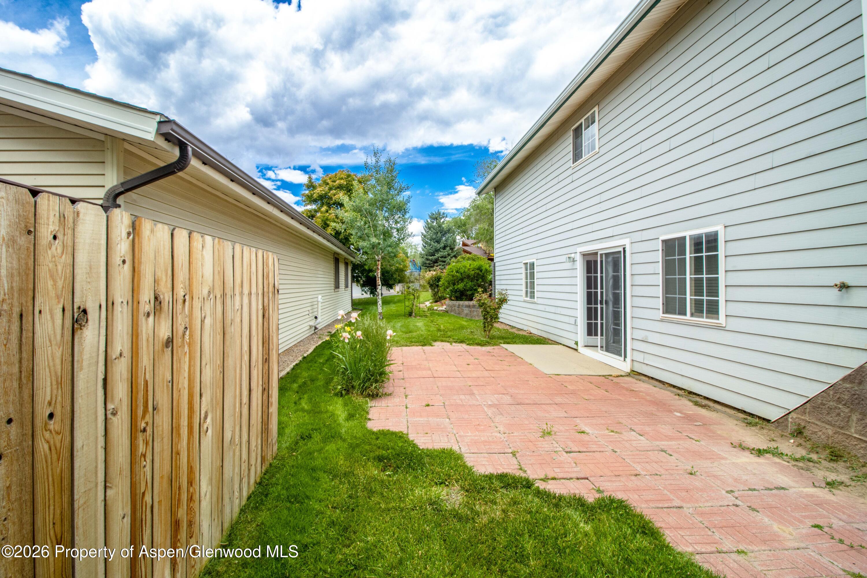 660 Aspen Avenue Rifle, CO 81650 - Photo 19 of 30 a yellow house with outdoor space