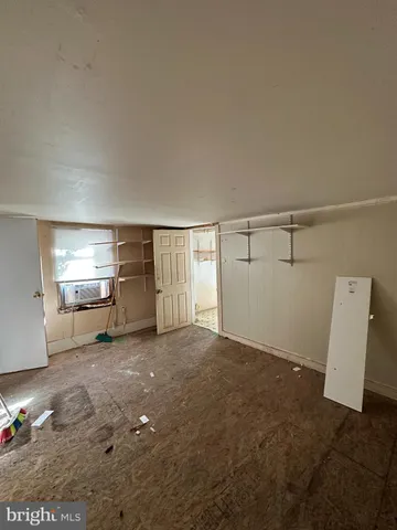 a view of a livingroom with furniture and window