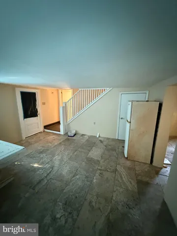 a view of a livingroom with a staircase