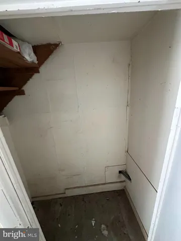 a view of storage and utility room with a small space