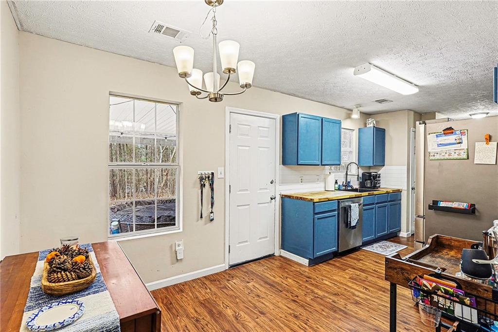 30 Pheasant Court Monticello, GA 31064 - Photo 11 of 30 a kitchen with stainless steel appliances granite countertop a stove and cabinets