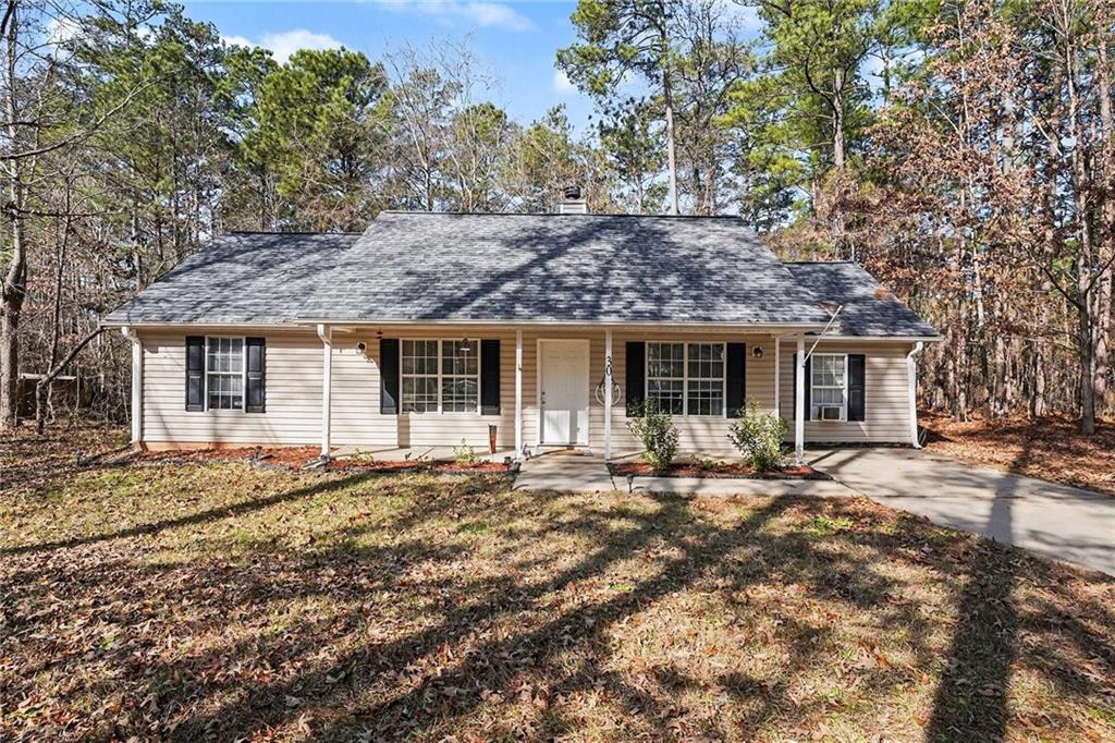 30 Pheasant Court Monticello, GA 31064 - Photo 2 of 30 front view of a house with a tree