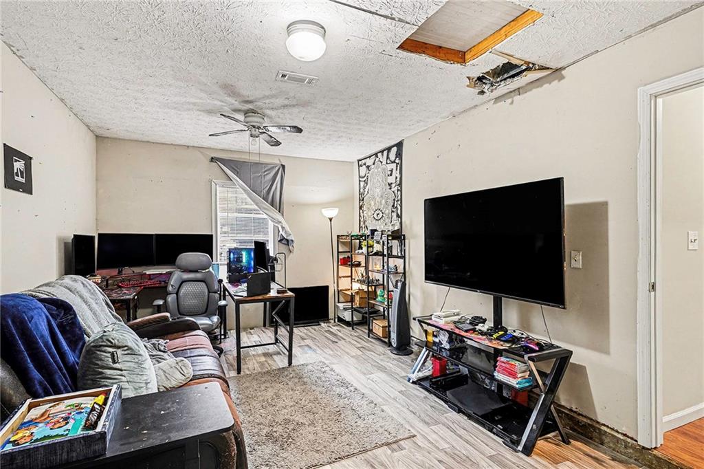 30 Pheasant Court Monticello, GA 31064 - Photo 21 of 30 a living room with furniture and a flat screen tv