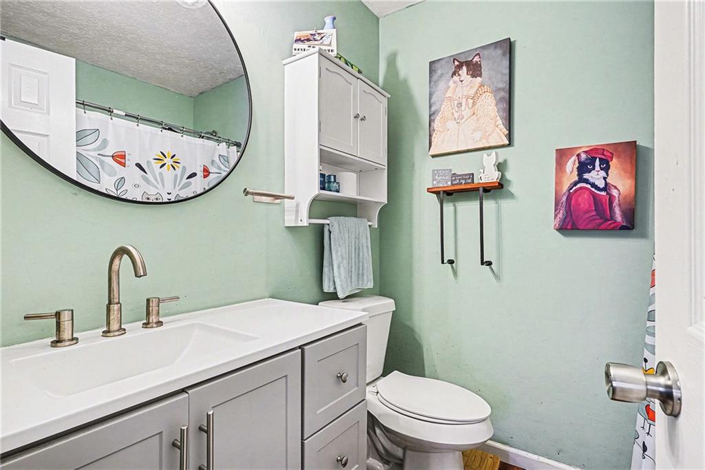 30 Pheasant Court Monticello, GA 31064 - Photo 24 of 30 a bathroom with a toilet a sink and a mirror