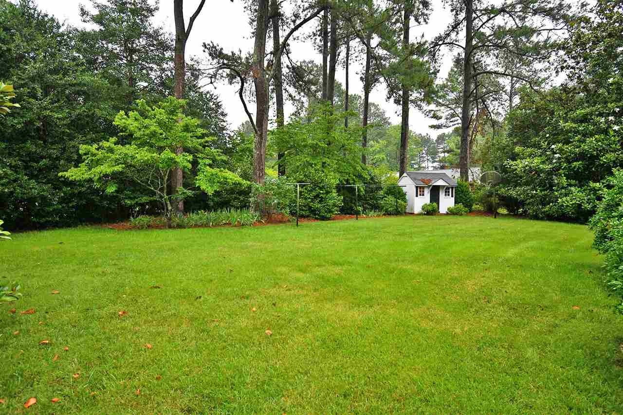 505 South Hollybrook Road Wendell, NC 27591 - Photo 23 of 24 Such a beautiful landscaped yard! Lots of space for those that enjoy the outdoors. Playhouse or can be used for a storage shed. Backyard