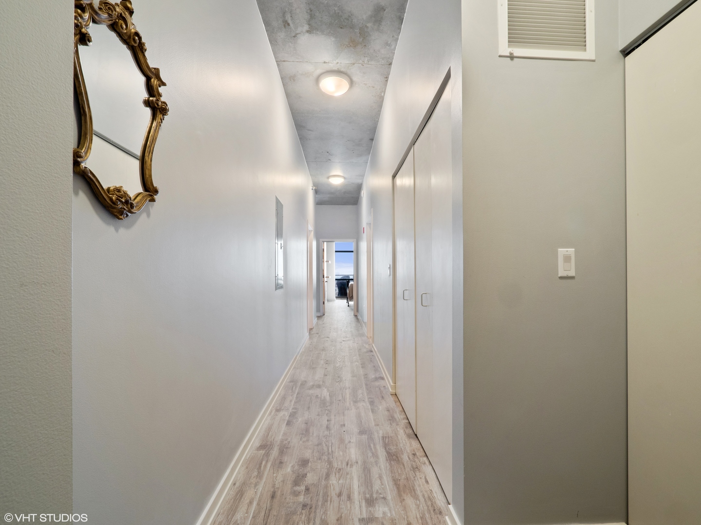 235 West Van Buren Street, Unit 2811 Chicago, IL 60607 - Photo 2 of 10 a view of a hallway with wooden floor