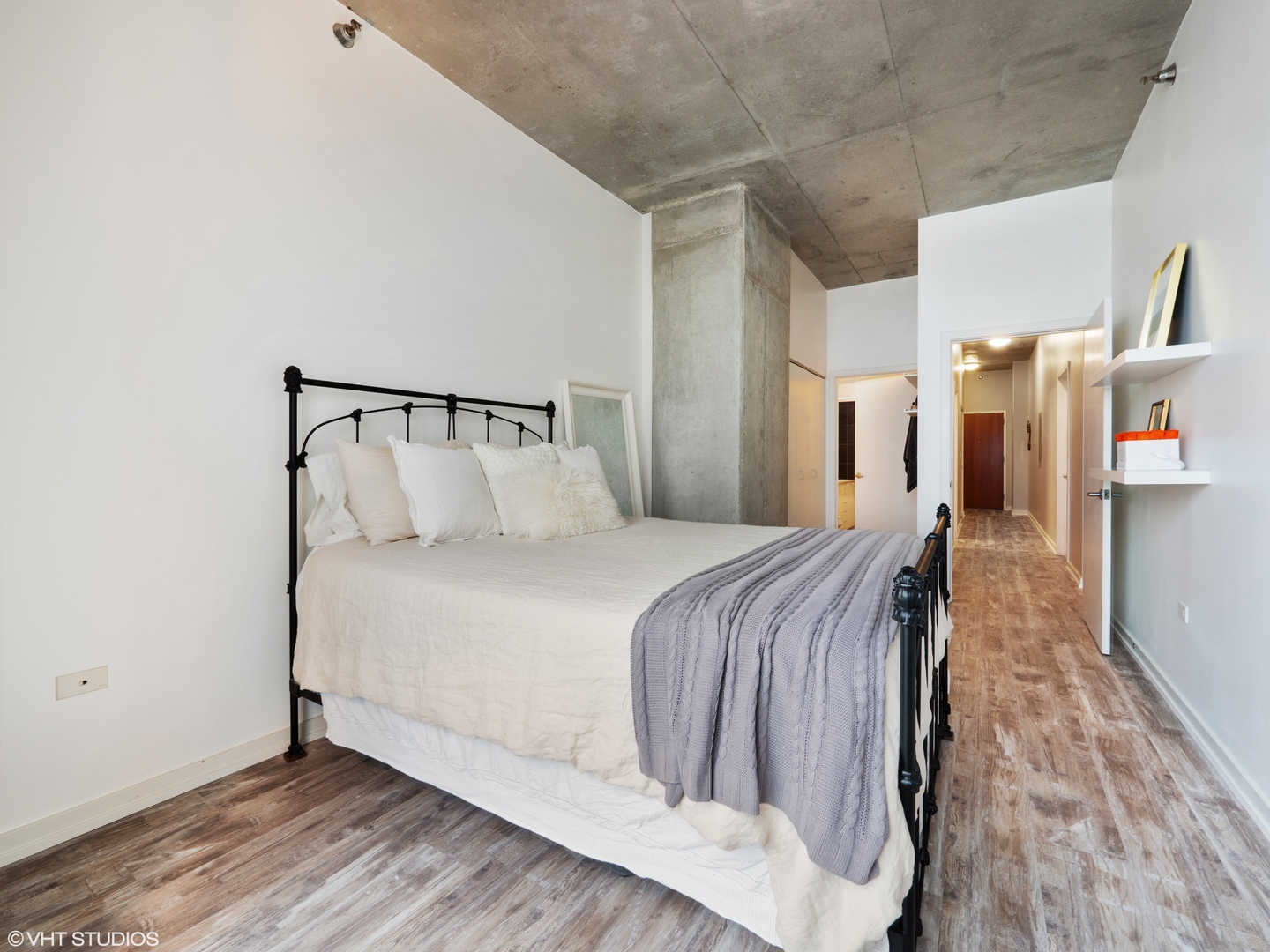 235 West Van Buren Street, Unit 2811 Chicago, IL 60607 - Photo 6 of 10 a bed room with a bed and a night stand