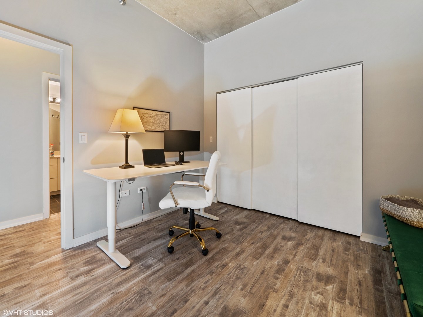 235 West Van Buren Street, Unit 2811 Chicago, IL 60607 - Photo 8 of 10 a view of a workspace with furniture and wooden floor