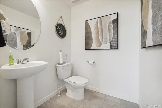 a bathroom with a toilet and a sink