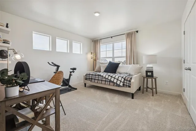 a bedroom with a bed and a table