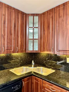 a view of a hallway with some storage and utility room