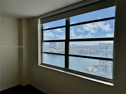 a view of a hallway with a room