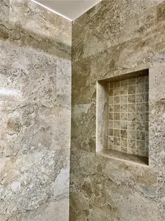 a bathroom with a shower and a toilet