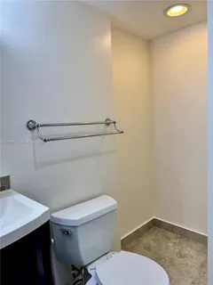 a bathroom with a sink vanity and a mirror