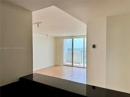 a kitchen with stainless steel appliances granite countertop a refrigerator stove and sink