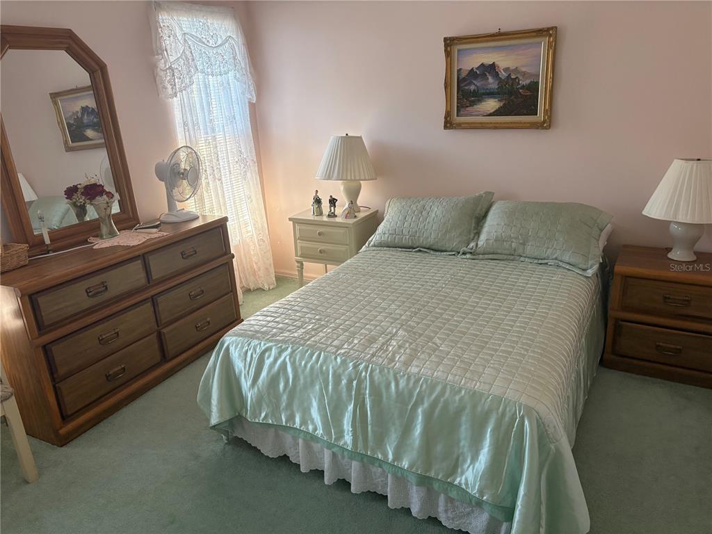 5338 Spanish Trail Holiday, FL 34690 - Photo 19 of 34 a bed sitting in a bedroom next to a window