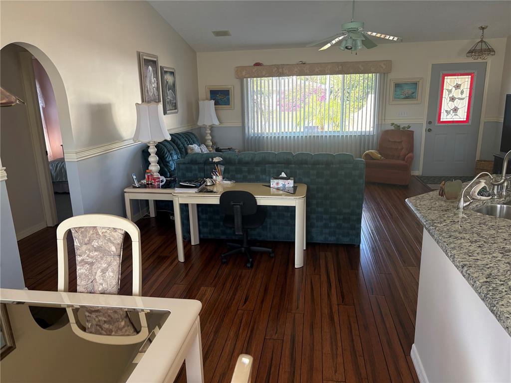 5338 Spanish Trail Holiday, FL 34690 - Photo 6 of 34 a living room with furniture and a fireplace