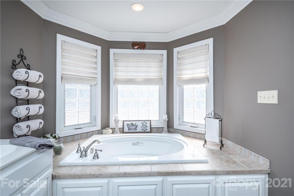 4542 Hickory Nut Ridge Road Granite Falls, NC 28630 - Photo 22 of 38 a bath tub sitting next to a window