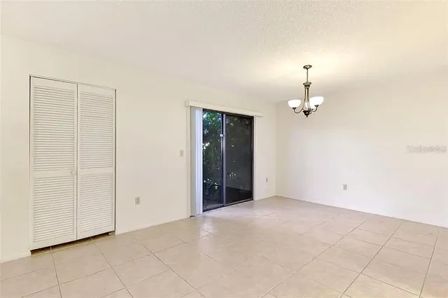 an empty room with a lamp