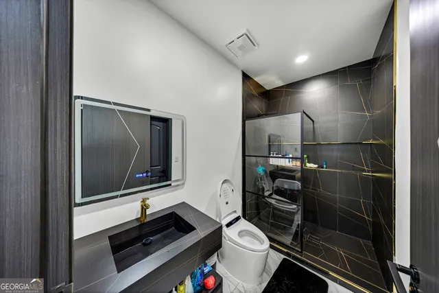 a view of a kitchen with a sink and microwave