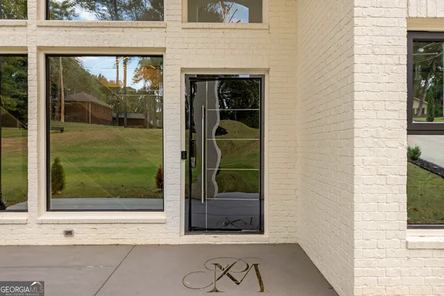 a view of a door and a window