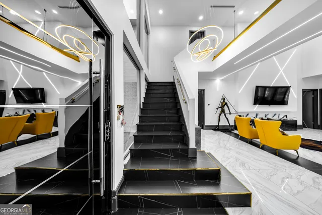 a view of entryway and hall with wooden floor