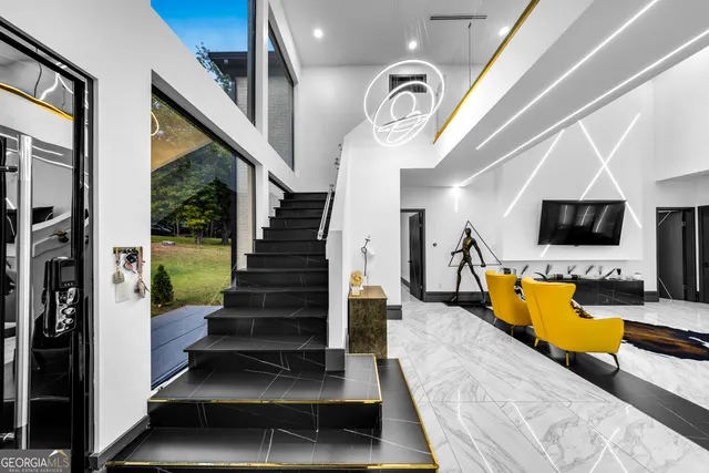 a view of entryway and hall with wooden floor
