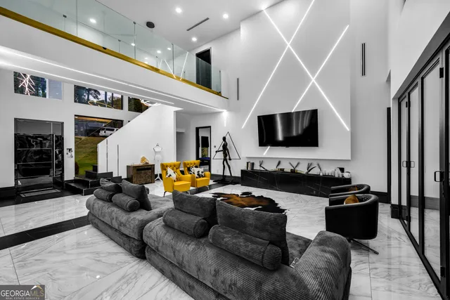 a living room with furniture and a flat screen tv