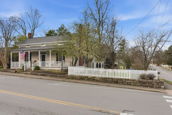 a view of a house with a street