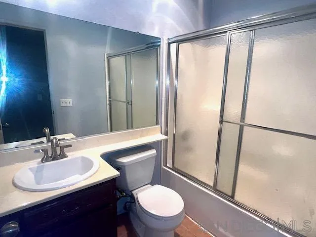 13802 Midland Road Poway, CA 92064 - Photo 5 of 12 a bathroom with a sink toilet and shower
