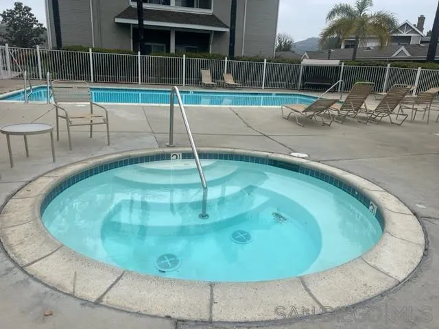 13802 Midland Road Poway, CA 92064 - Photo 9 of 12 a view of a swimming pool with a sitting space