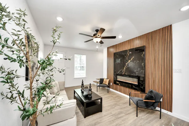 a living room with furniture and a flat screen tv