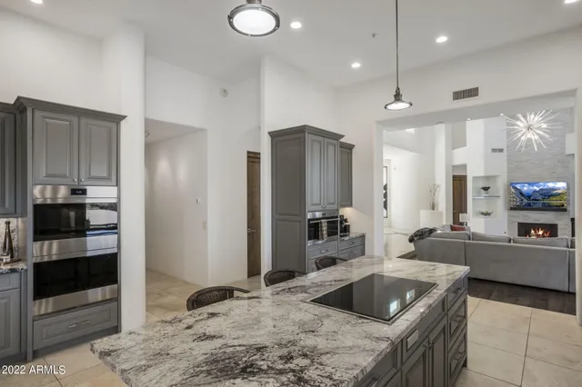 a dining room with furniture a window and a kitchen view