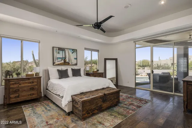 a bedroom with a large bed and a window