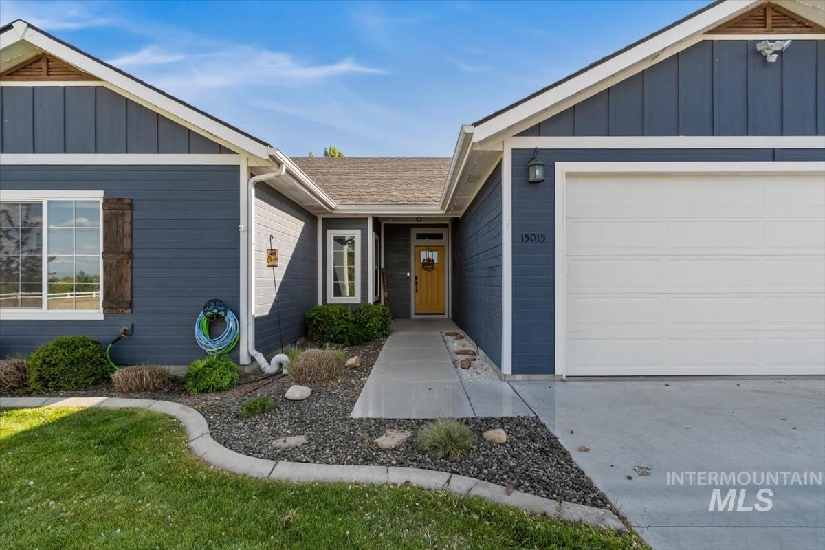 15015 Leon Lane Caldwell, ID 83607 - Photo 2 of 44 Contemporary-style residence featuring deep blue siding and white trim