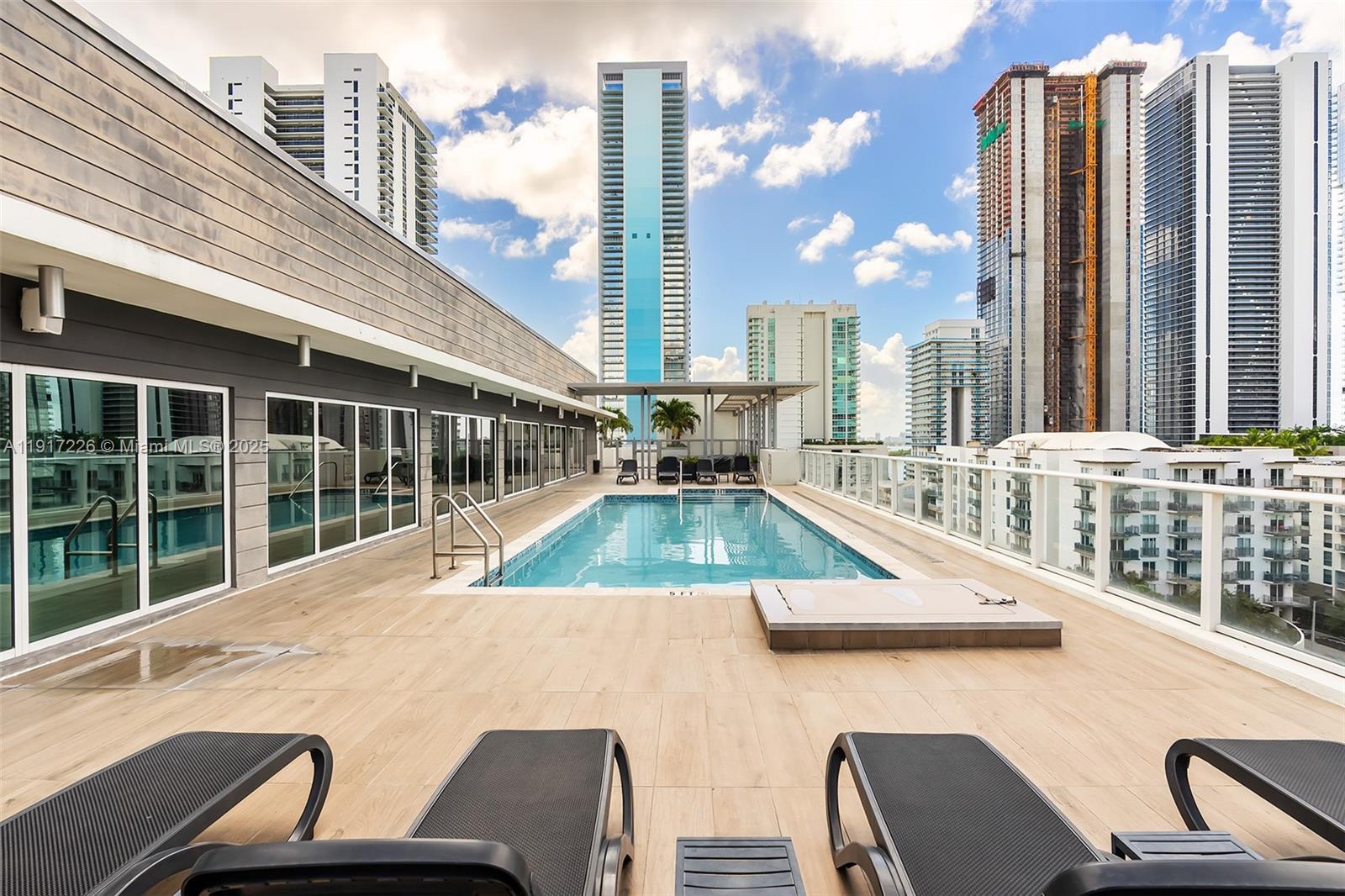 321 Northeast 26th Street, Unit 614 Miami, FL 33137 - Photo 14 of 22 a view of a balcony with two chairs and a table