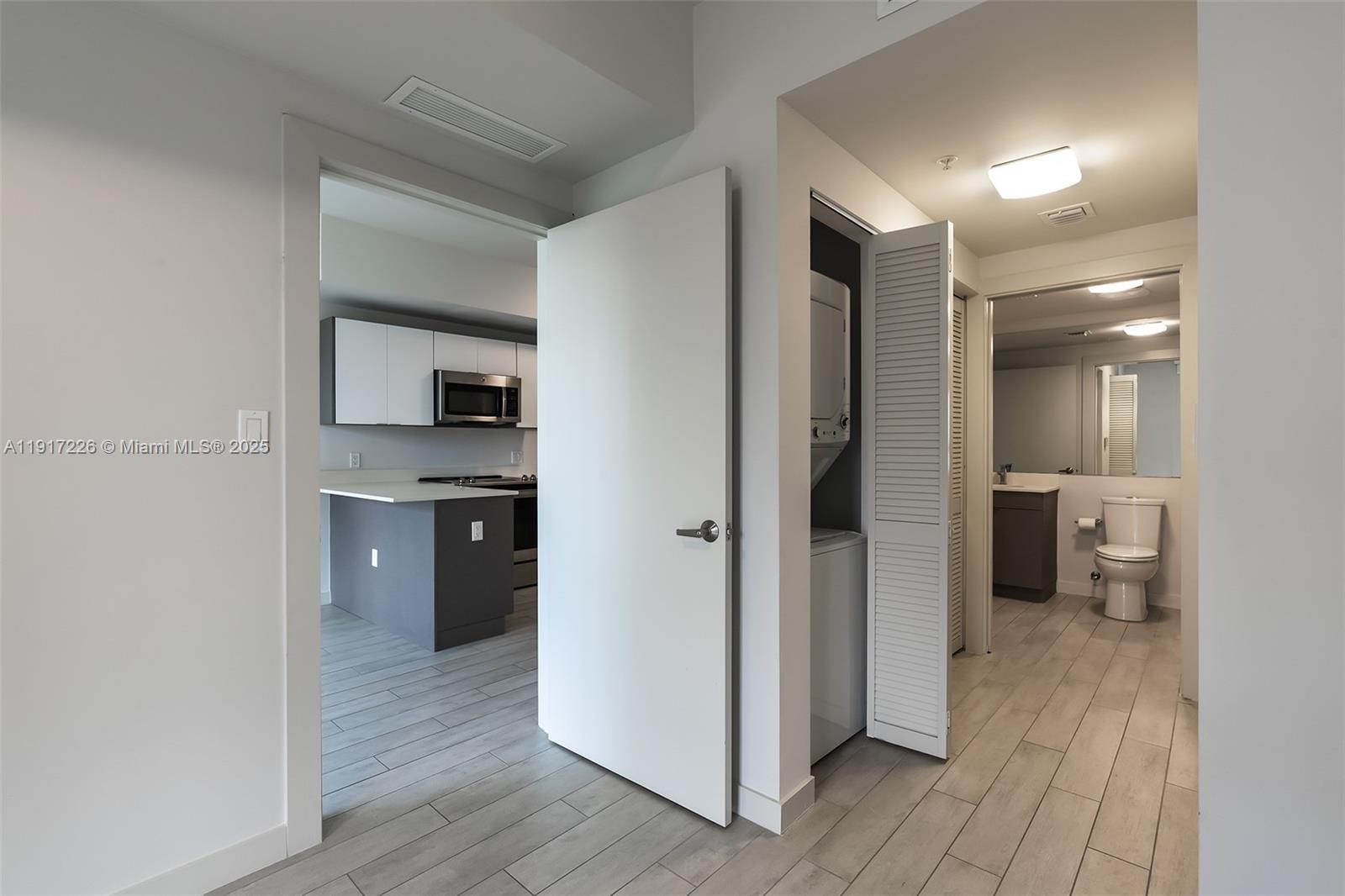 321 Northeast 26th Street, Unit 614 Miami, FL 33137 - Photo 8 of 22 a view of a kitchen from the hallway