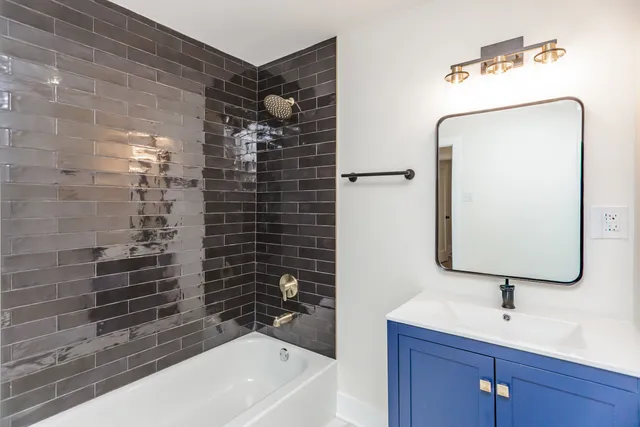 a bathroom with a sink a vanity and a mirror