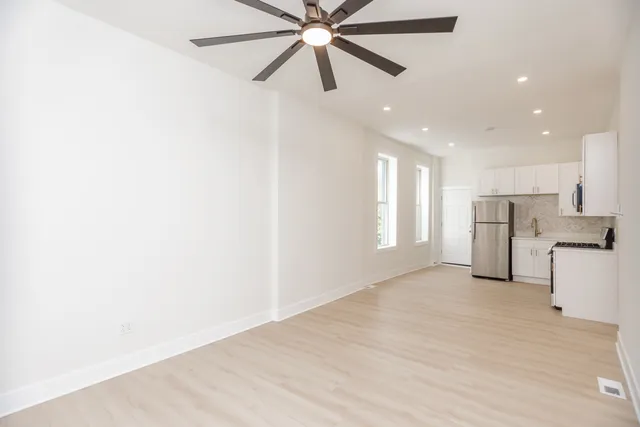 a view of a kitchen with a sink and cabinet area