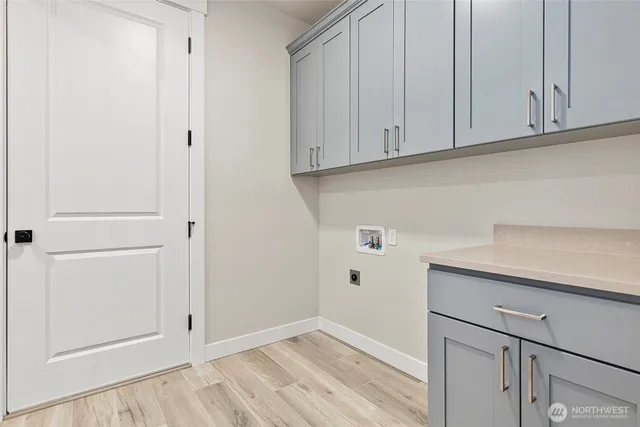 a view of cabinets and wooden floor