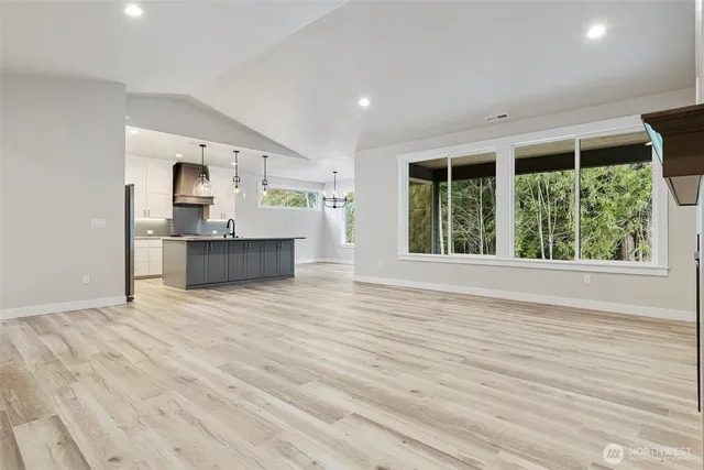 a view of kitchen and wooden floor